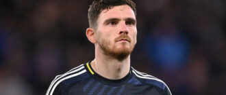Andrew Robertson, do Liverpool, sofre lesão no ombro enquanto representa a Escócia